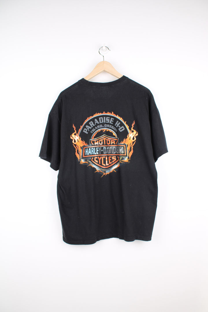 Harley Davidson t-shirt in black with printed skull graphic on the front and flaming Harley logo on the back. good condition - light line mark on the front under the skull graphic (see photos) Size in Label: Mens XL- Measures more like a L