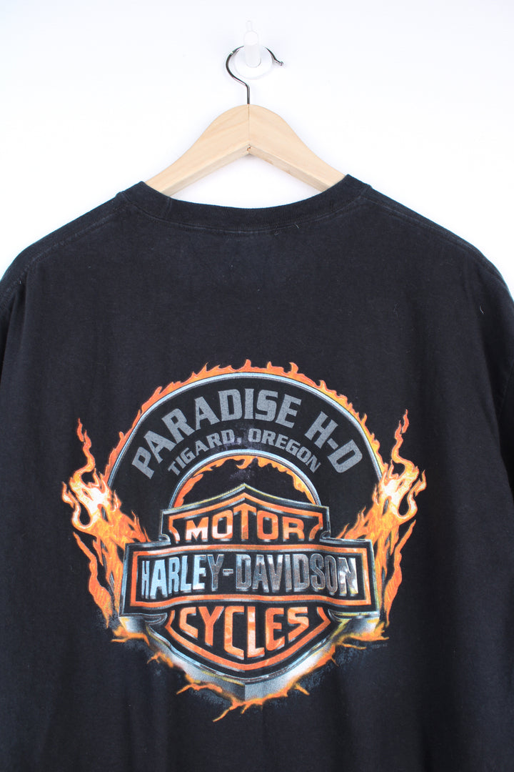 Harley Davidson t-shirt in black with printed skull graphic on the front and flaming Harley logo on the back. good condition - light line mark on the front under the skull graphic (see photos) Size in Label: Mens XL- Measures more like a L