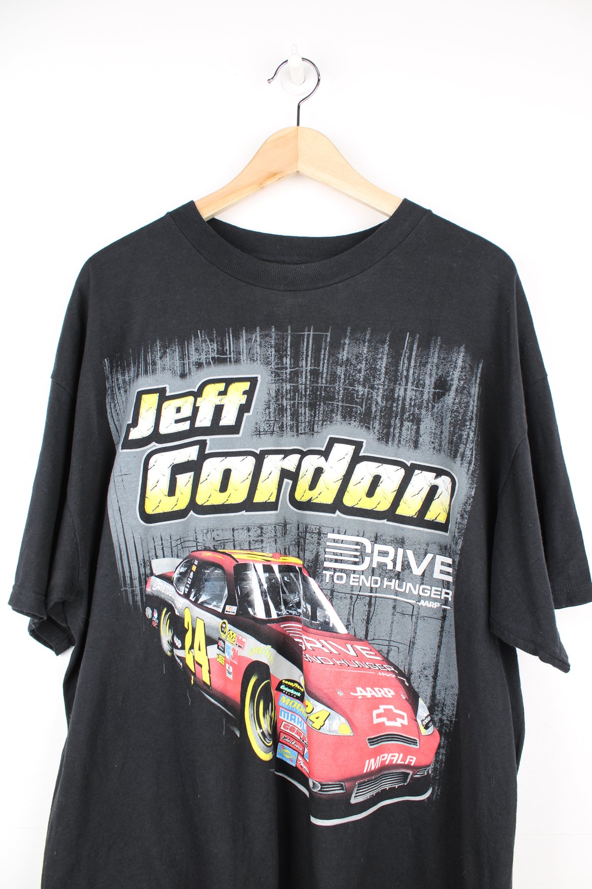 Modern Jeff Gordon Nascar racing t-shirt. Black t-shirt with graphic on the front and back. good condition Size in Label: Mens XL - Measures more like a L