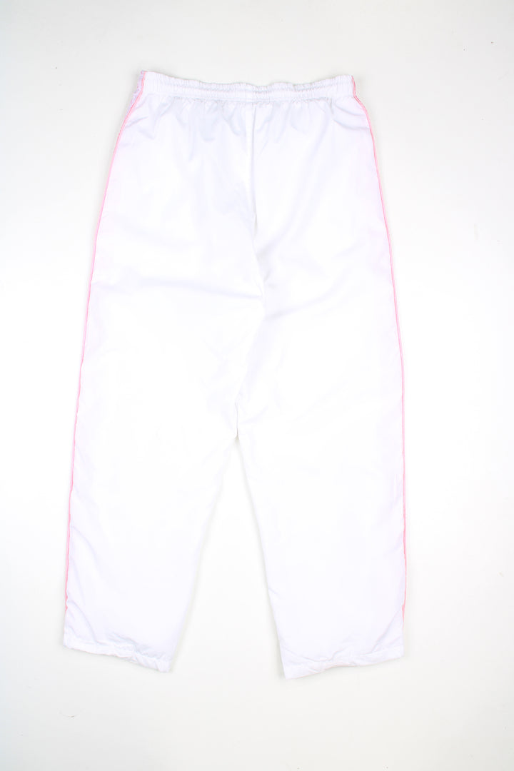 Vintage Kappa tracksuit bottoms in a white colourway with pink logo going down the sides, elasticated waist, and has logo embroidered on the front.