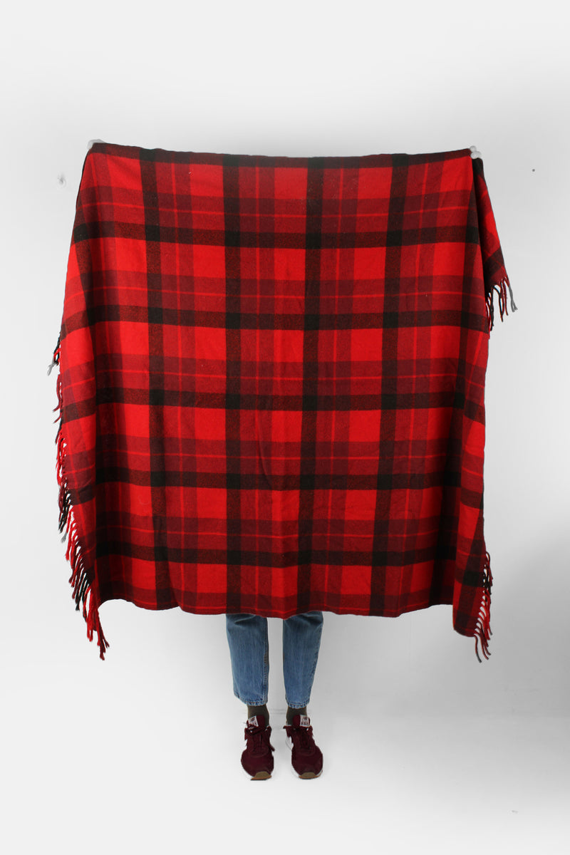 Vintage Pendleton check/ plaid wool blanket in red and a greenish black colourway. Made from 100% virgin wool and features fringe down two of the sides. good condition  Size in Label: Width: 51 inches Length: 59 inches 