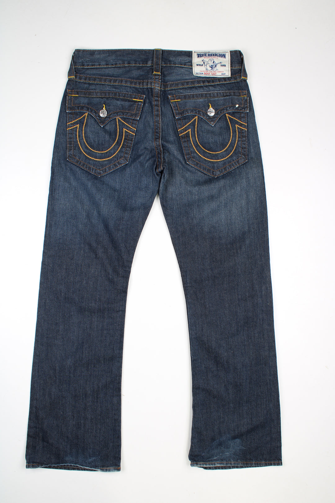 Vintage True Religion mid rise bootcut jeans with contrast stitching.  good condition - distressed at the cuffs (see photos)  Size in Label:   33