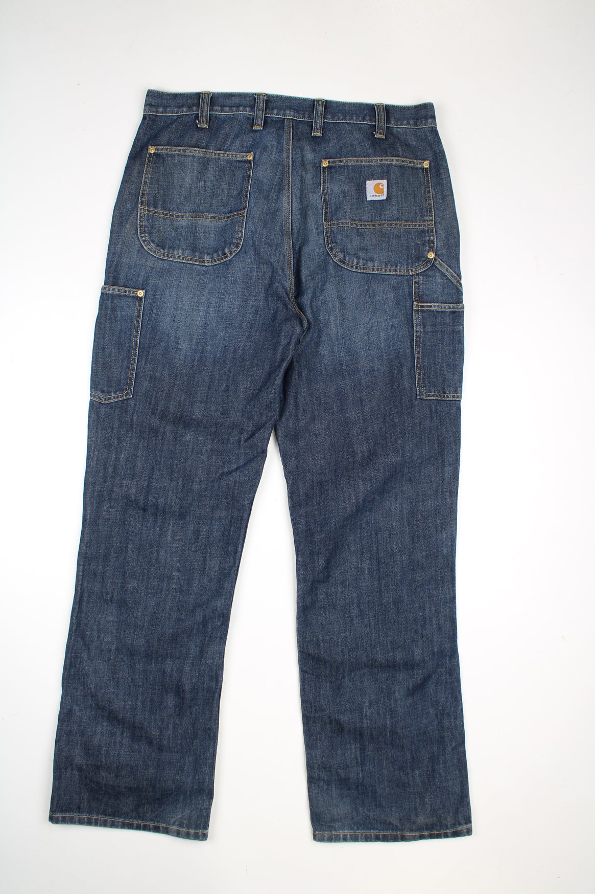 Carhartt blue denim double front logger style jeans with multiple pockets and contrast stitching