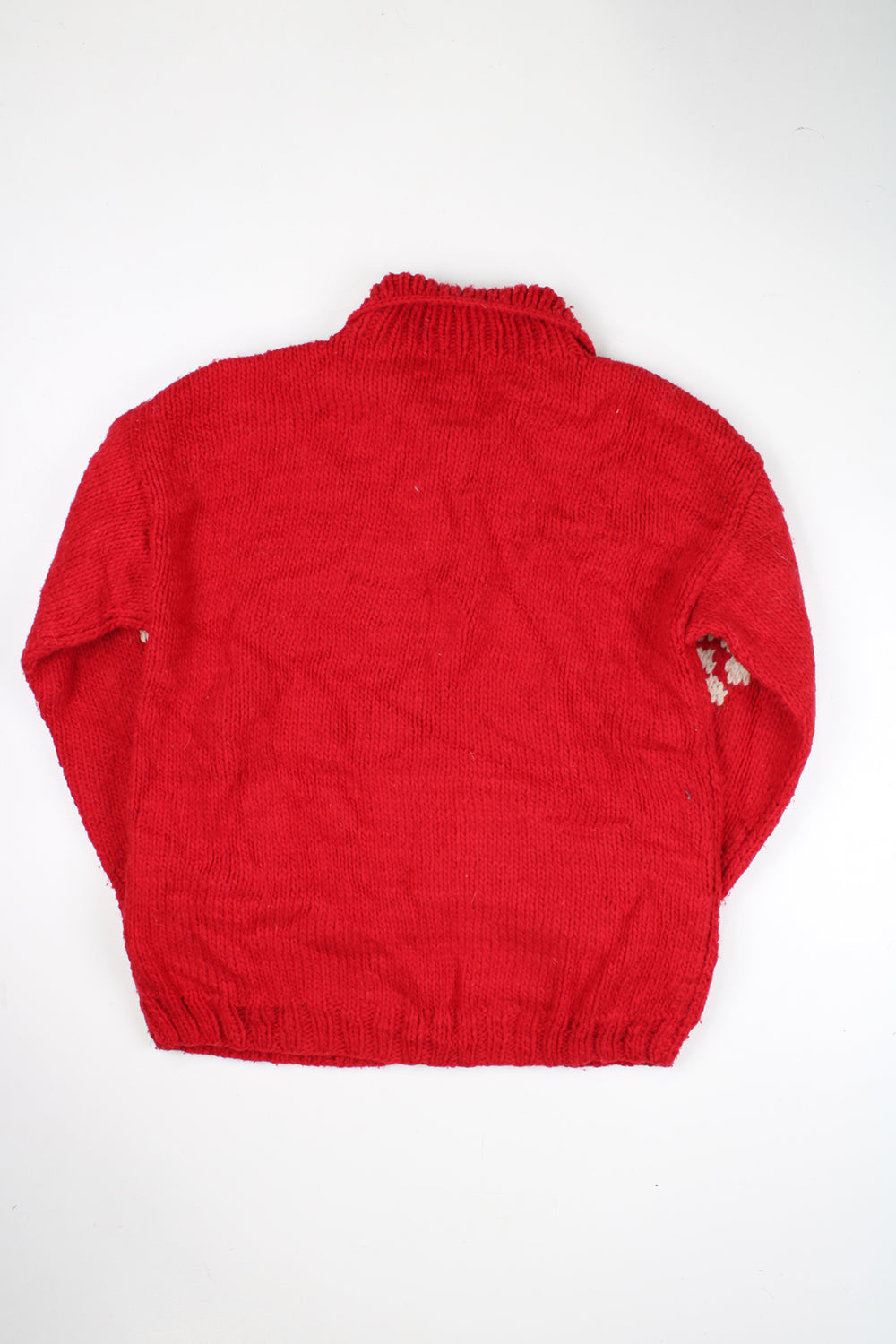 Vintage red knit cardigan with white daisy design. Made by the brand Otavalo in Ecuador from 100% wool and closes with a full zip.  good condition  Size in Label:  N/A- measures like a M