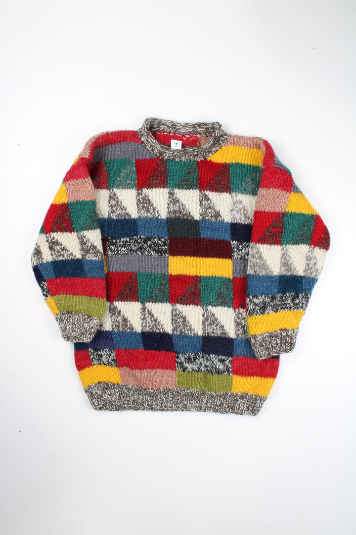 Vintage multicoloured knit jumper with geometric design. Made by the brand Ends of the Earth in Nepal from 100% wool. good condition - mark on the arm (see photos) Size in Label: N/A- measures like an M