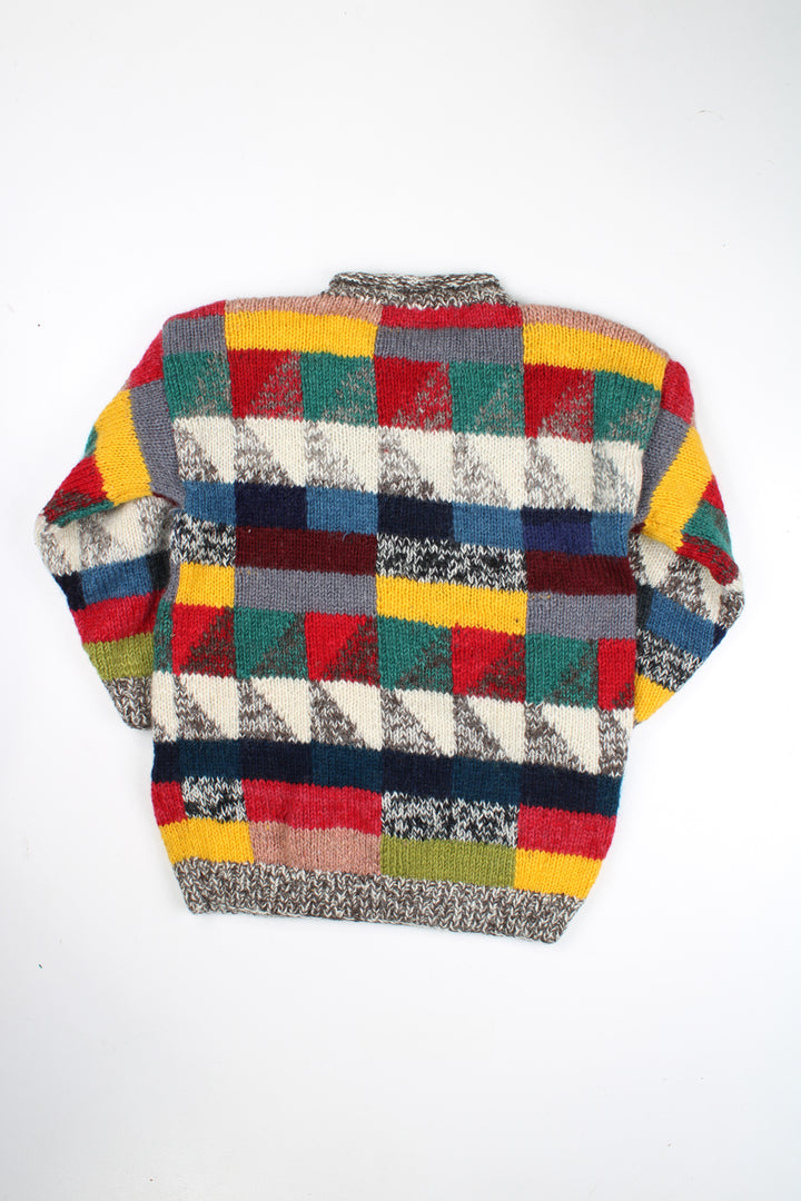 Vintage multicoloured knit jumper with geometric design. Made by the brand Ends of the Earth in Nepal from 100% wool. good condition - mark on the arm (see photos) Size in Label: N/A- measures like an M