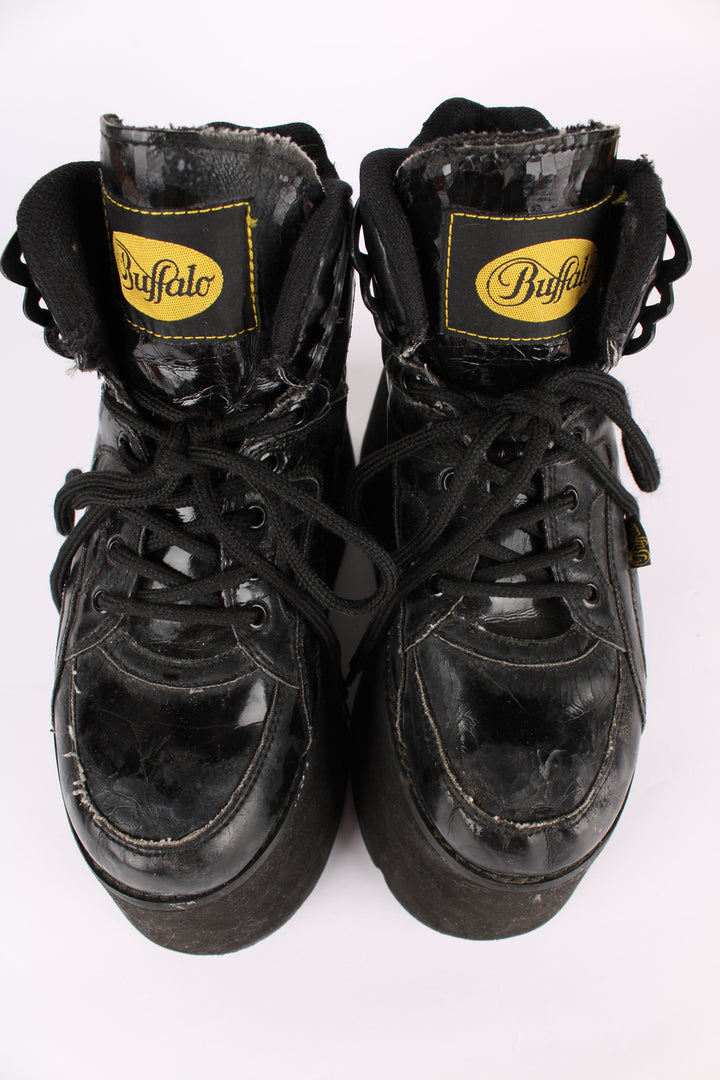 Buffalo Tower black patent leather platform lace up trainers, featuring buffalo branding on the back of the heel