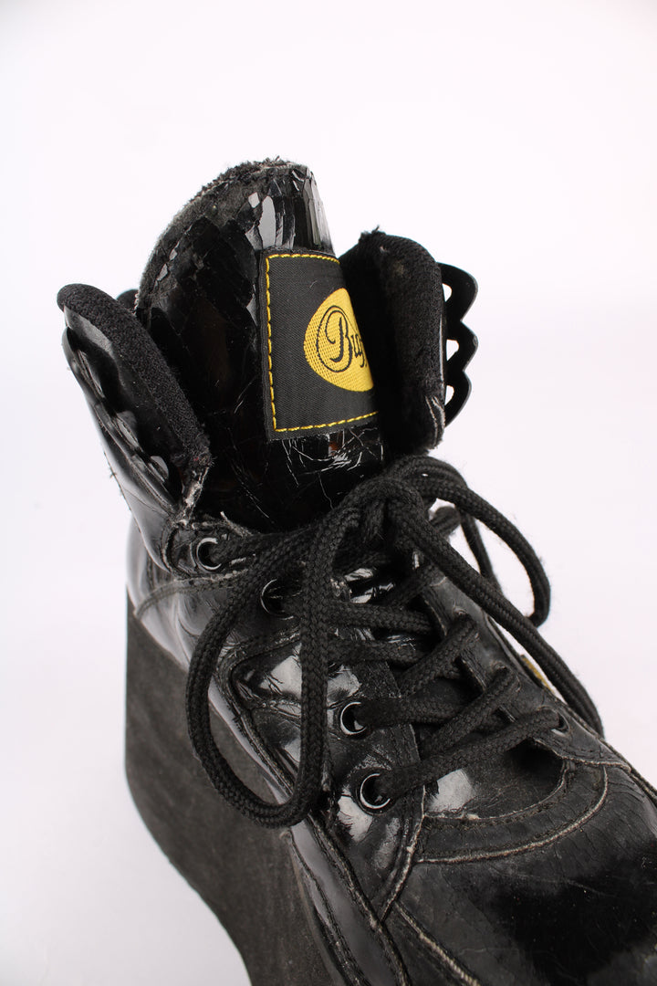 Buffalo Tower black patent leather platform lace up trainers, featuring buffalo branding on the back of the heel