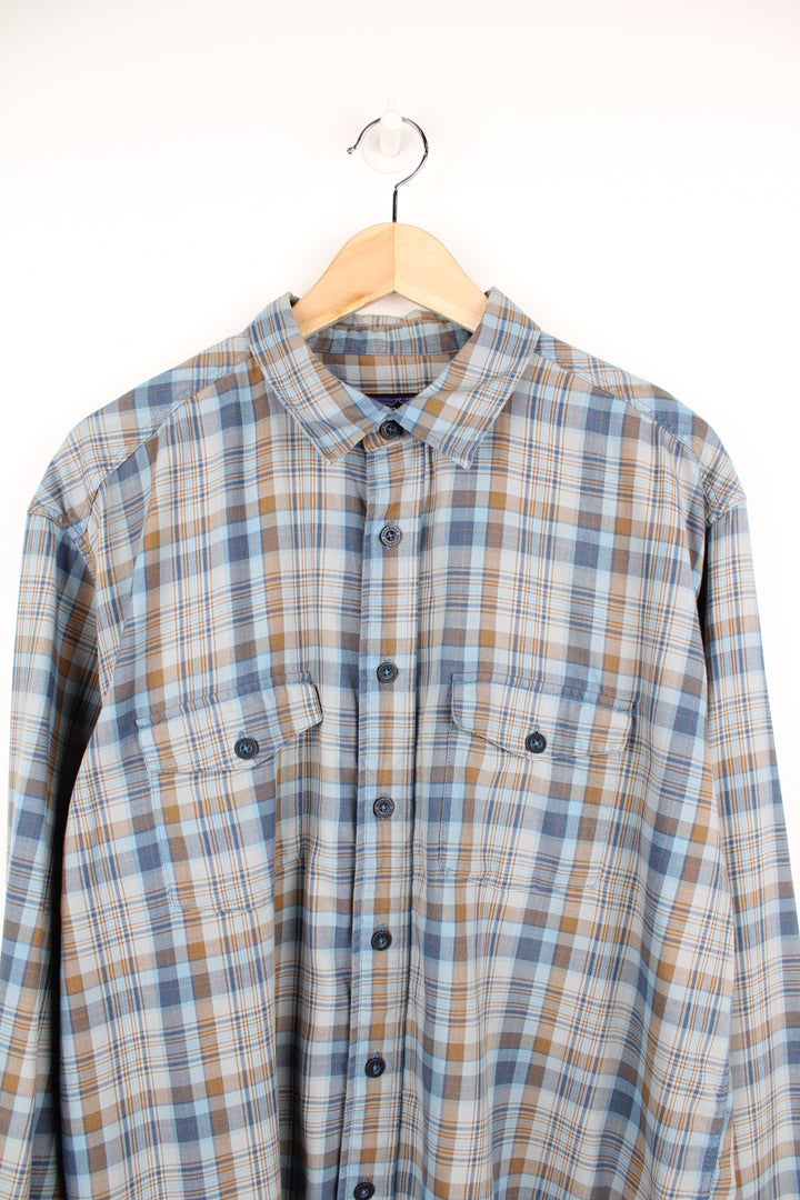 Patagonia Plaid Shirt in a blue and brown colourway, button up, double chest pockets and has the logo embroidered on the side.