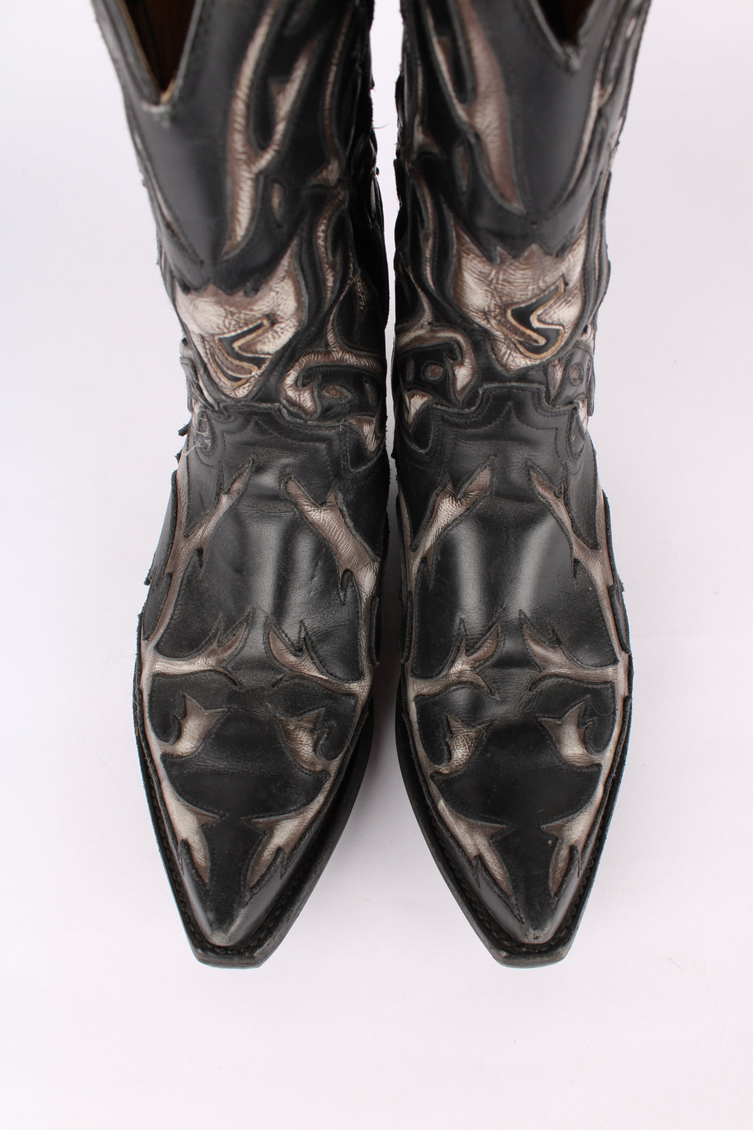 Vintage real leather black and grey cowboy boots features western cut out embroidery on the uppers