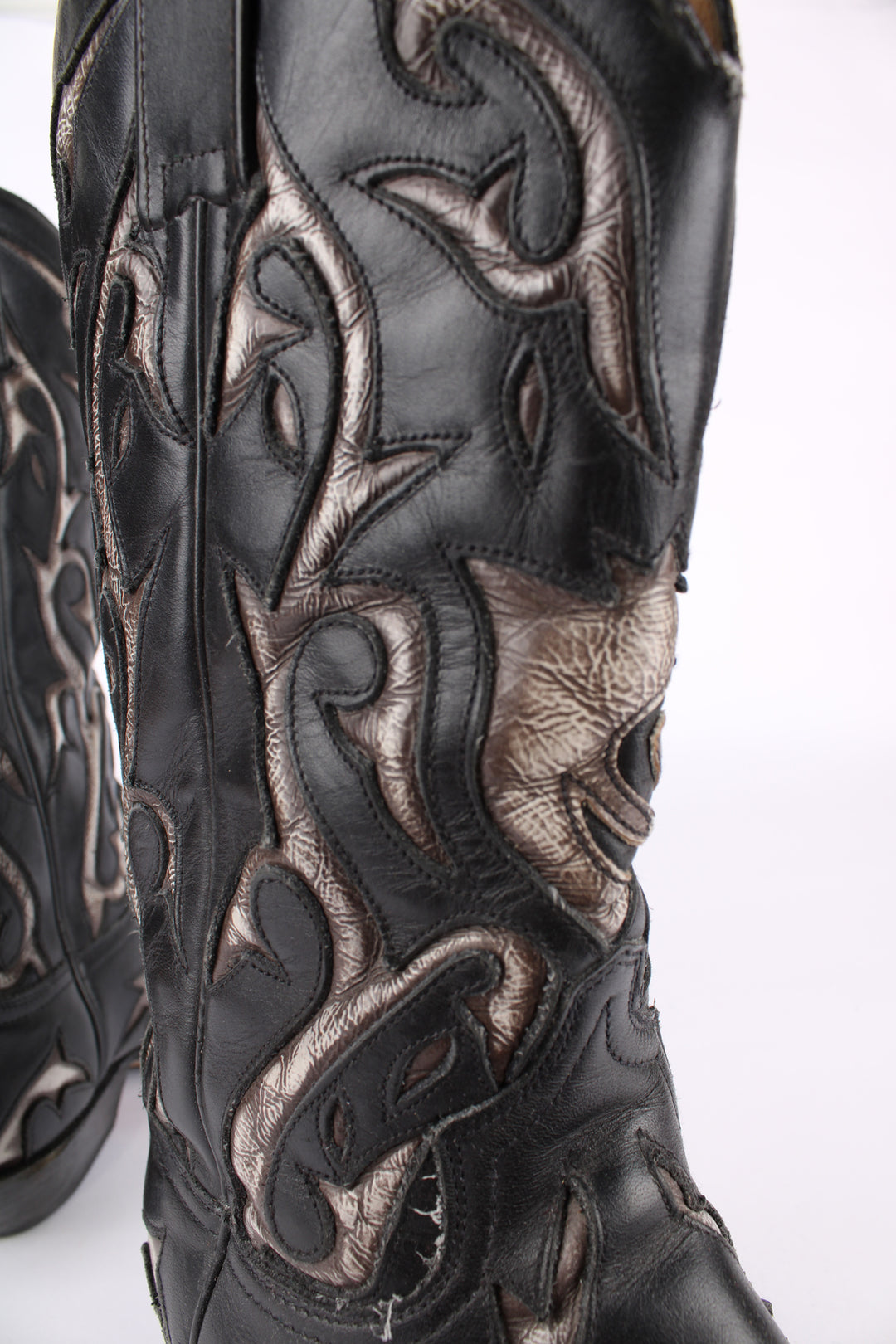 Vintage real leather black and grey cowboy boots features western cut out embroidery on the uppers