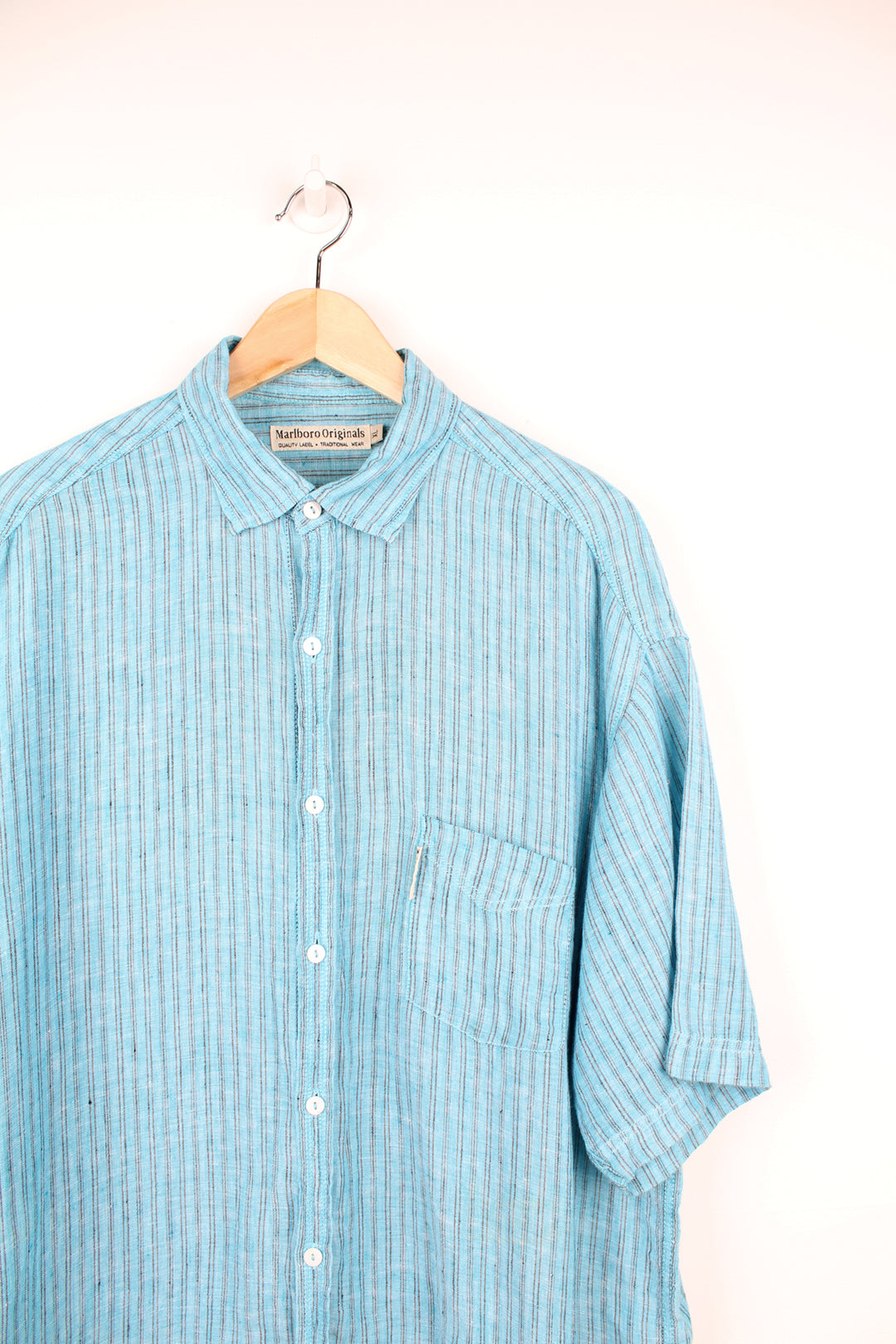 Vintage Marlborough Originals short sleeve shirt in blue pinstripe. Features white Marlborough tab on the pocket. good condition - very small mark near the pocket (see photos) Size in Label: Mens XL