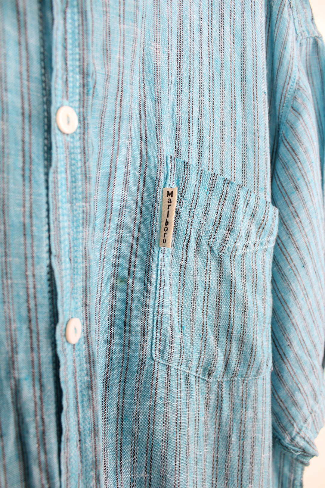 Vintage Marlborough Originals short sleeve shirt in blue pinstripe. Features white Marlborough tab on the pocket. good condition - very small mark near the pocket (see photos) Size in Label: Mens XL