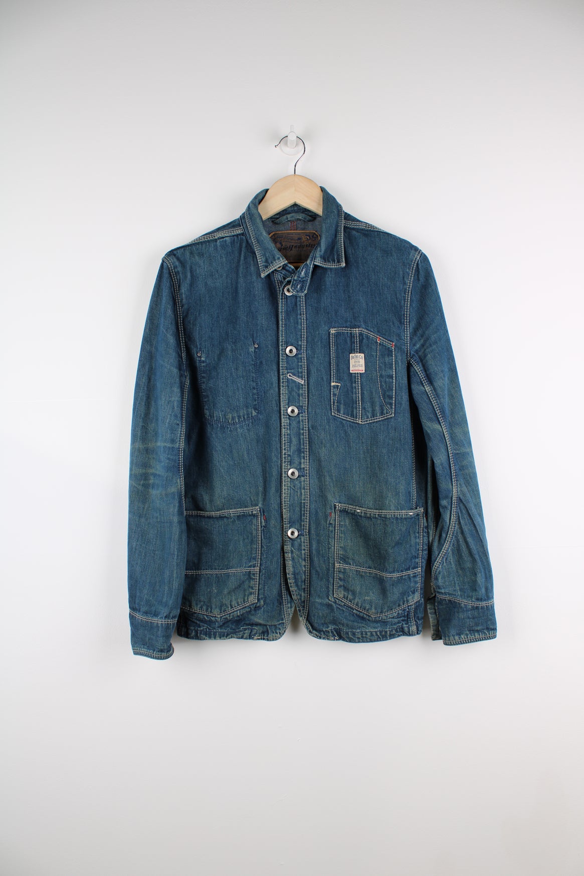 Vintage Diesel denim chore style button up jacket with utility pockets and embroidered logo on the chest.  good condition  Size in label:  Women&