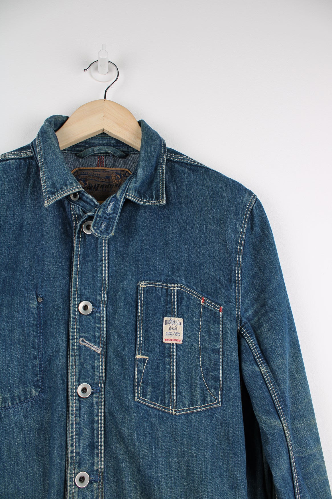 Vintage Diesel denim chore style button up jacket with utility pockets and embroidered logo on the chest.  good condition  Size in label:  Women&