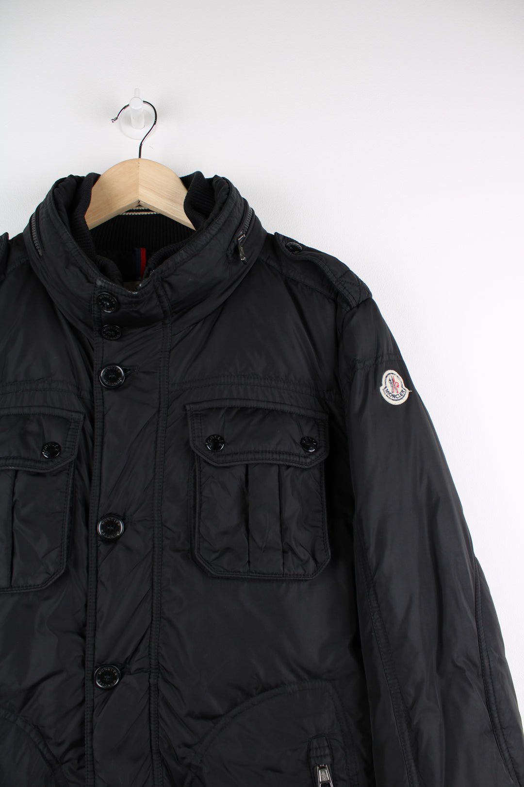 Vintage Moncler black puffer coat with fold away hood, embroidered badge on the sleeve and zip up pockets  good condition   Size in Label:  N/A- Measures like a S (see measurements below)