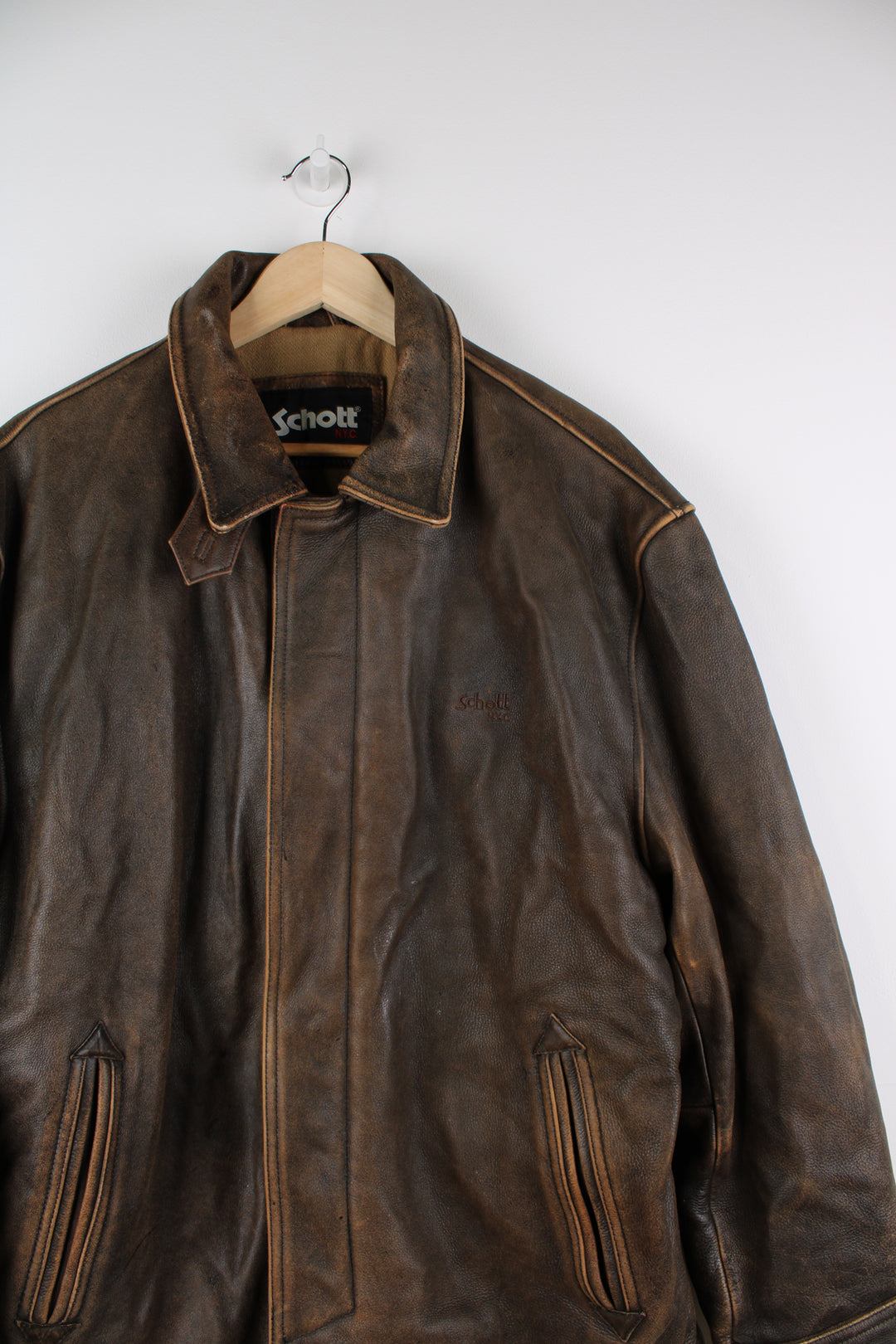 Vintage Schott NYC brown worn leather bomber jacket, closes with a zip and popper buttons.   good condition  Size in Label:   Mens L 