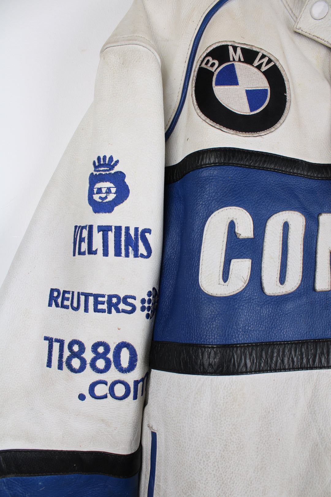 Vintage 90's BMW Compaq leather racer jacket with sponsor logos detail on the front and back.  good condition - white parts of the leather are significantly discolored and the blue parts on the arms have some scuffs (see photos)  Size in Label: Mens S 