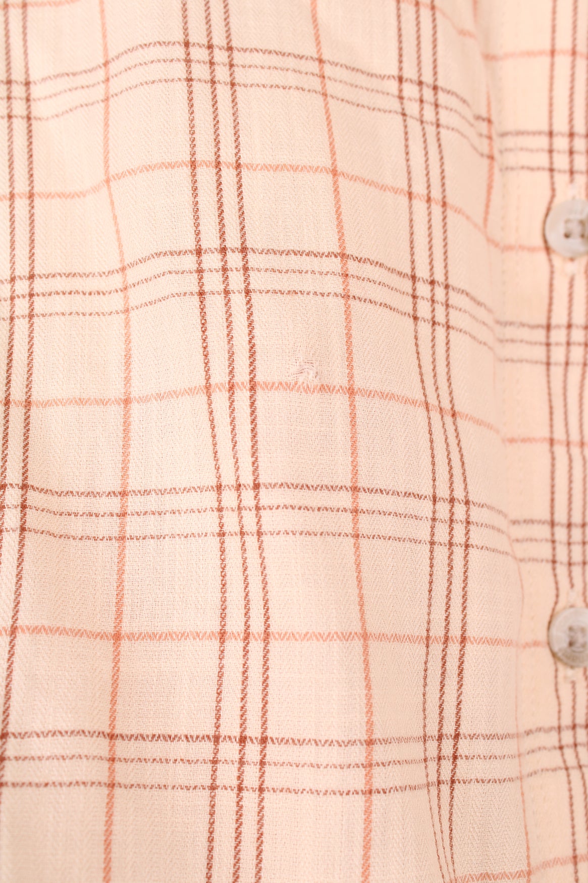 Carhartt Plaid Short Sleeve Shirt in a tan and red colourway, button up, cropped fit, has hidden side pockets, and also has the logo embroidered on the chest pocket.