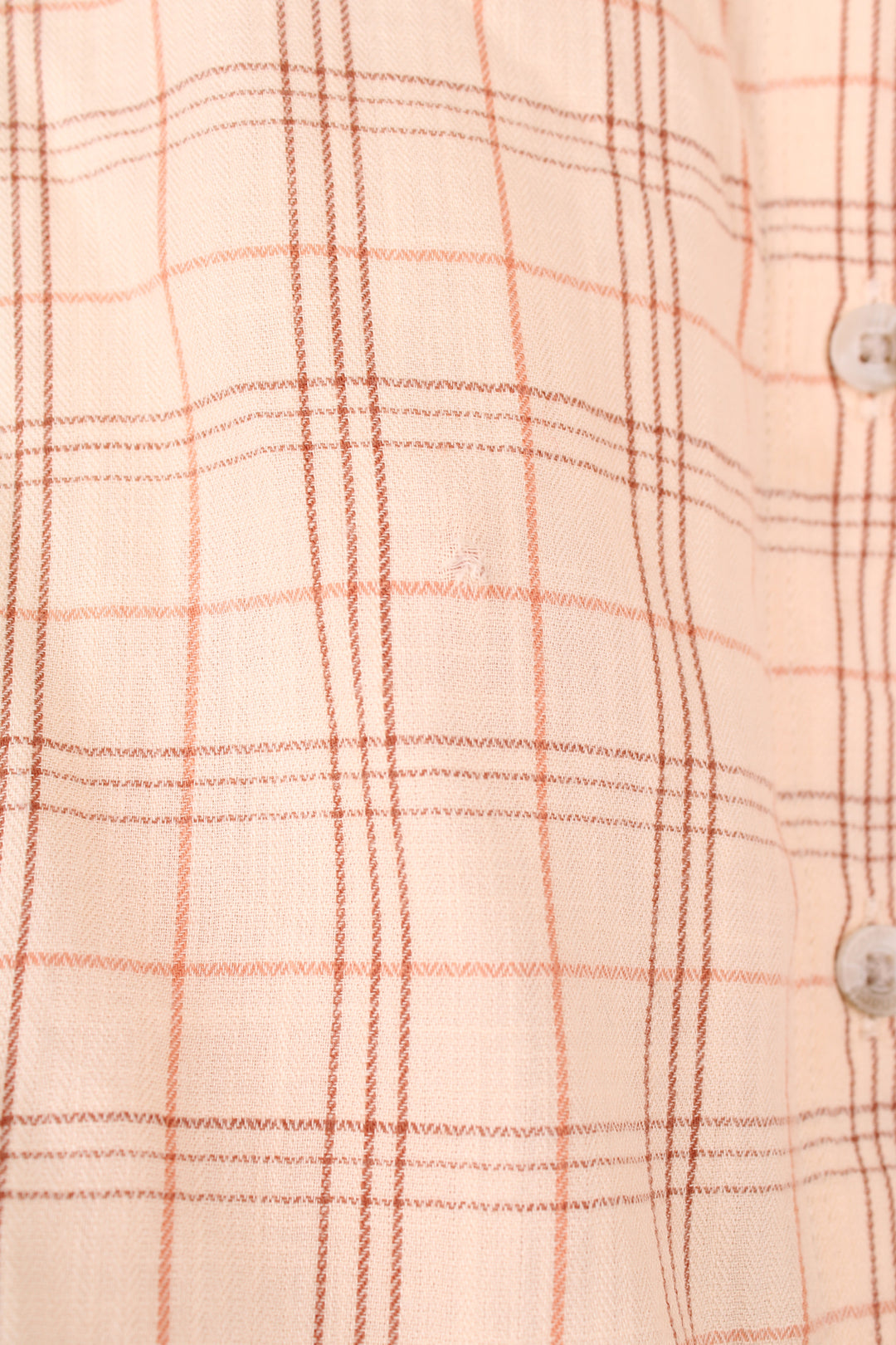 Carhartt Plaid Short Sleeve Shirt in a tan and red colourway, button up, cropped fit, has hidden side pockets, and also has the logo embroidered on the chest pocket.