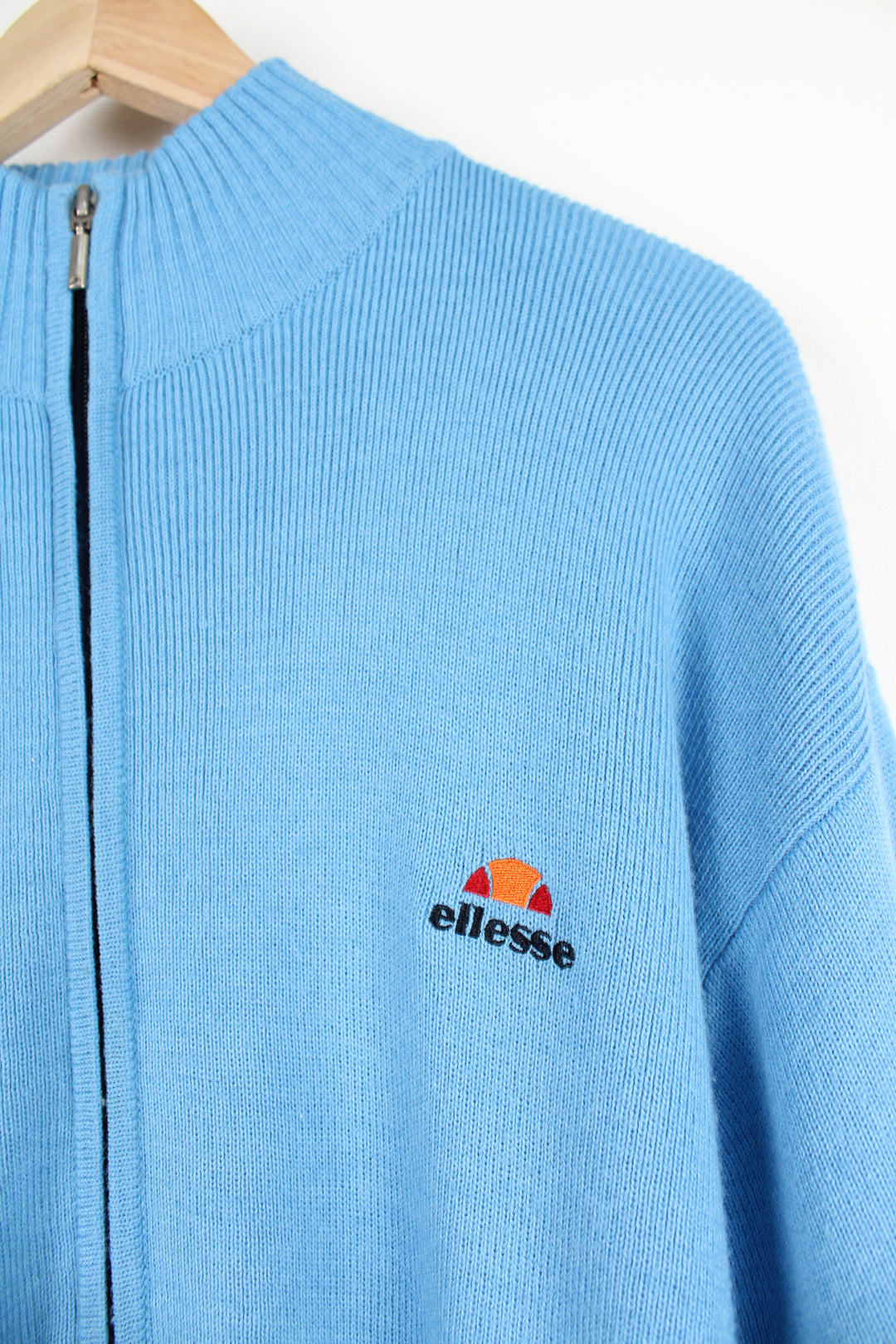 Vintage Ellesse blue and black knitted zip through jumper with embroidered logo on chest