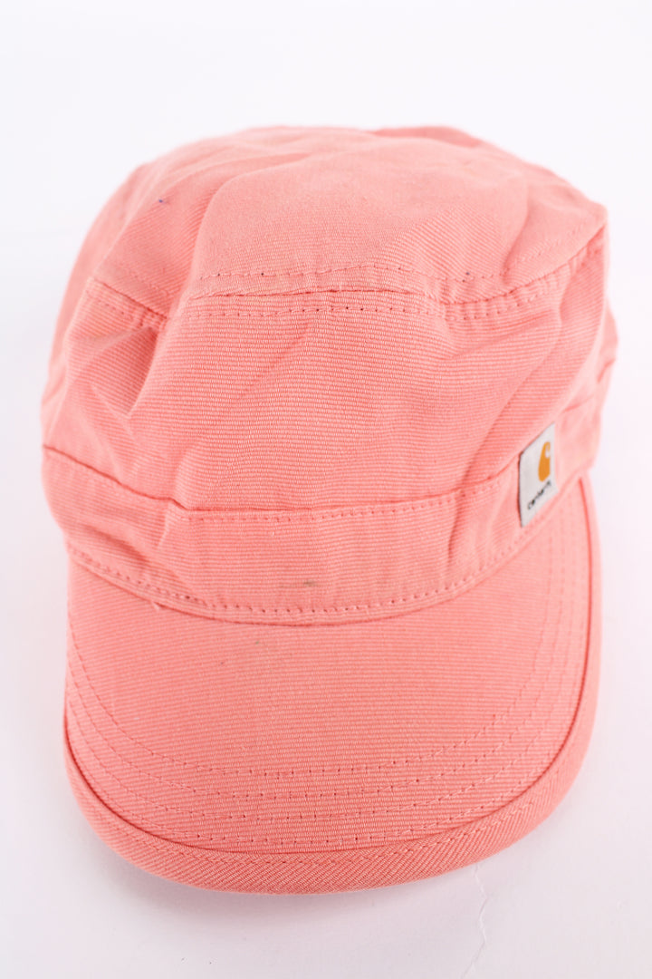 Carhartt pink baker boy style cap with patch logo on the front. Has an adjustable strap at the back. 