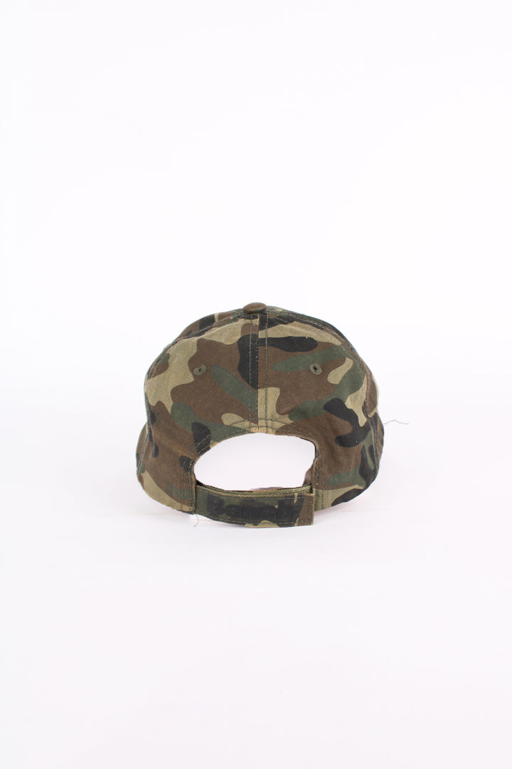 Y2K Bench camouflage baseball cap features embroidered spell-out logo across the front and adjustable velcro strap 