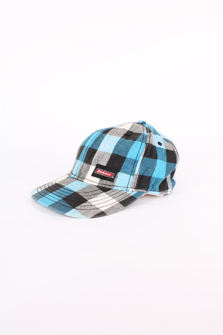 Dickies blue and black plaid baseball cap with embroidered Dickies logo on the front. Has an adjustable strap at the back