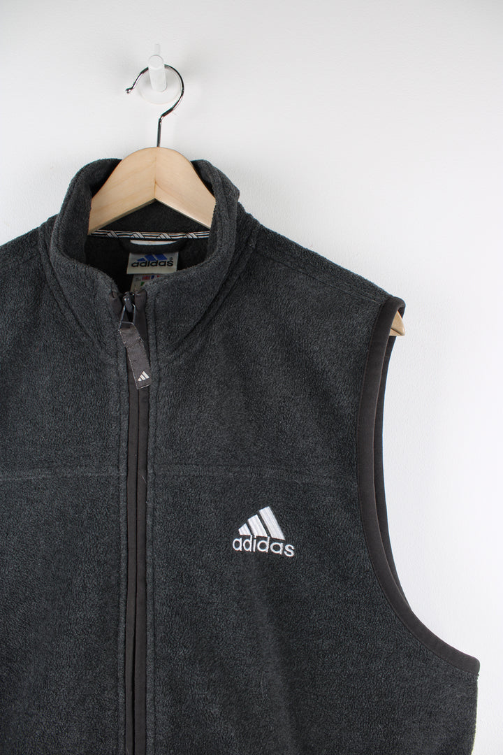 Adidas grey fleece, zip through gilet. features an embroidered logo on its chest and double pockets