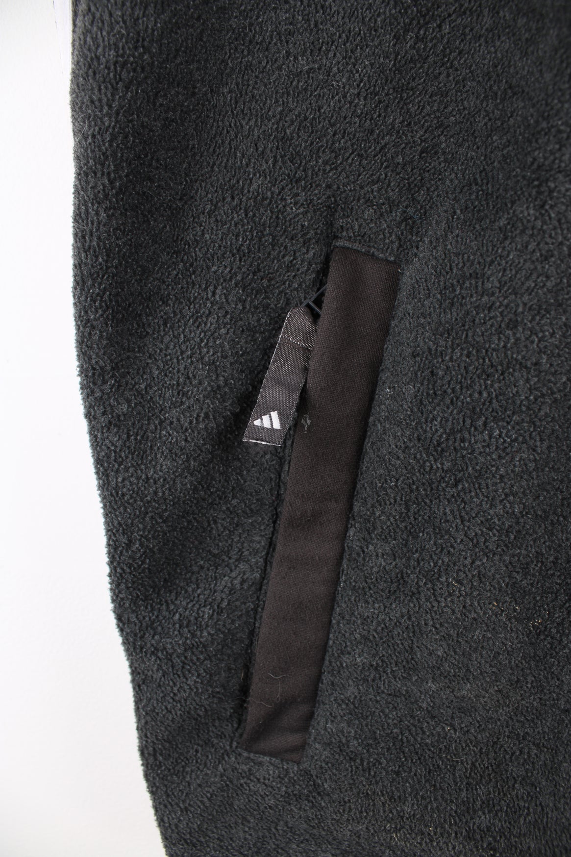 Adidas grey fleece, zip through gilet. features an embroidered logo on its chest and double pockets