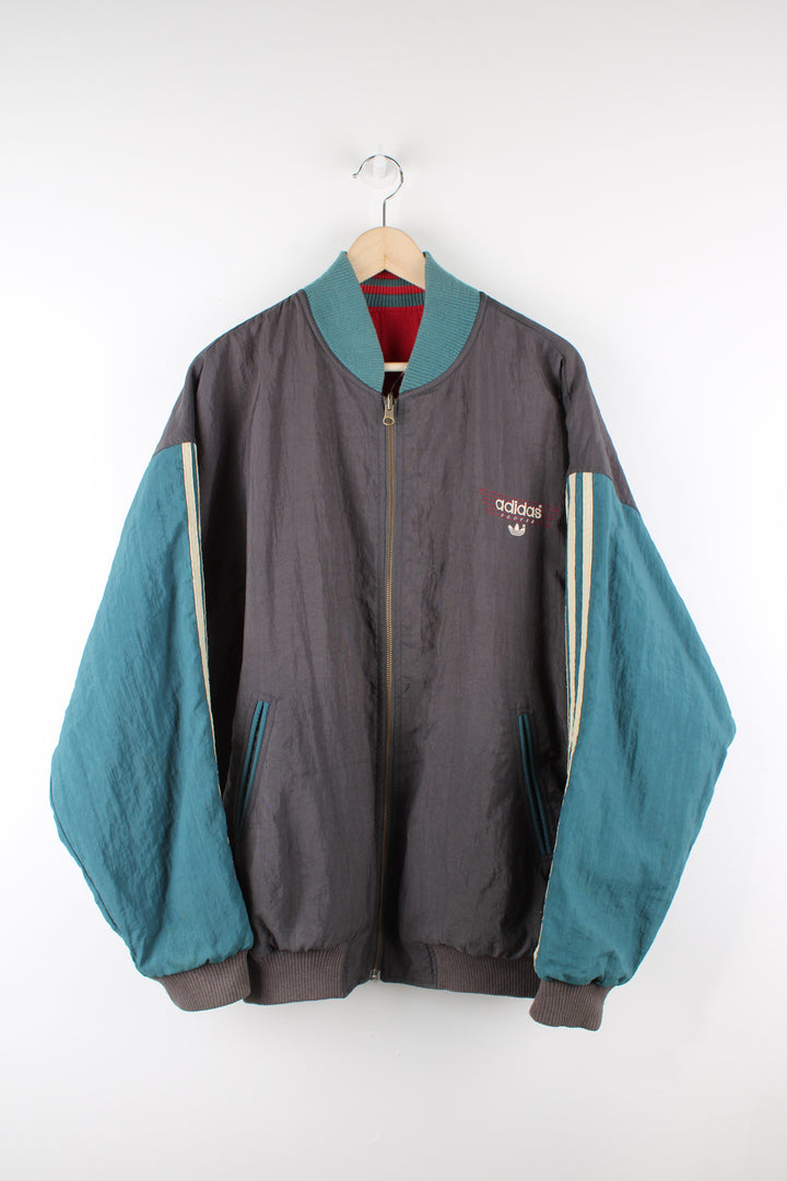 Vintage 80's Adidas, Liverpool football team reversible bomber jacket, red and green or grey and green colourway options, multiple pockets, and has logos embroidered throughout the jacket. 