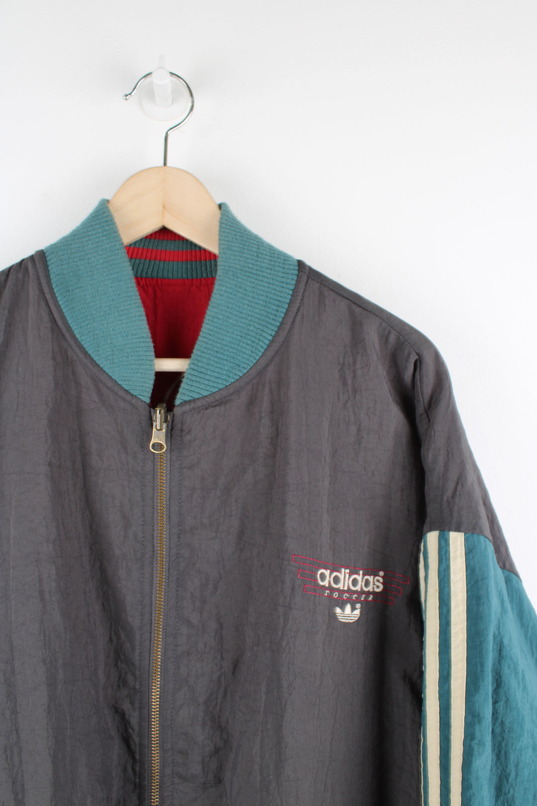 Vintage 80's Adidas, Liverpool football team reversible bomber jacket, red and green or grey and green colourway options, multiple pockets, and has logos embroidered throughout the jacket. 