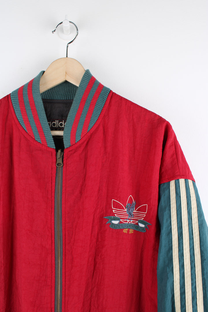 Vintage 80's Adidas, Liverpool football team reversible bomber jacket, red and green or grey and green colourway options, multiple pockets, and has logos embroidered throughout the jacket. 