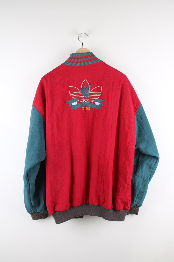 Vintage 80's Adidas, Liverpool football team reversible bomber jacket, red and green or grey and green colourway options, multiple pockets, and has logos embroidered throughout the jacket. 