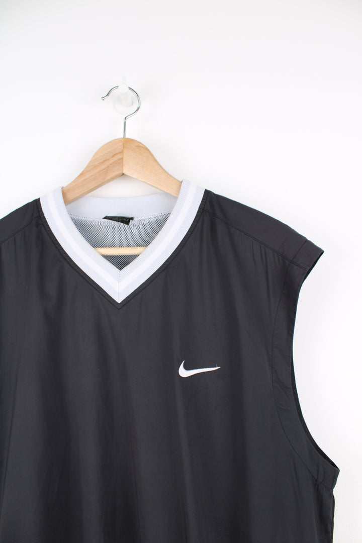 Nike Lightweight Training Vest in a black and grey colourway, v neck, mesh lining, and has the swoosh logo embroidered on the front.