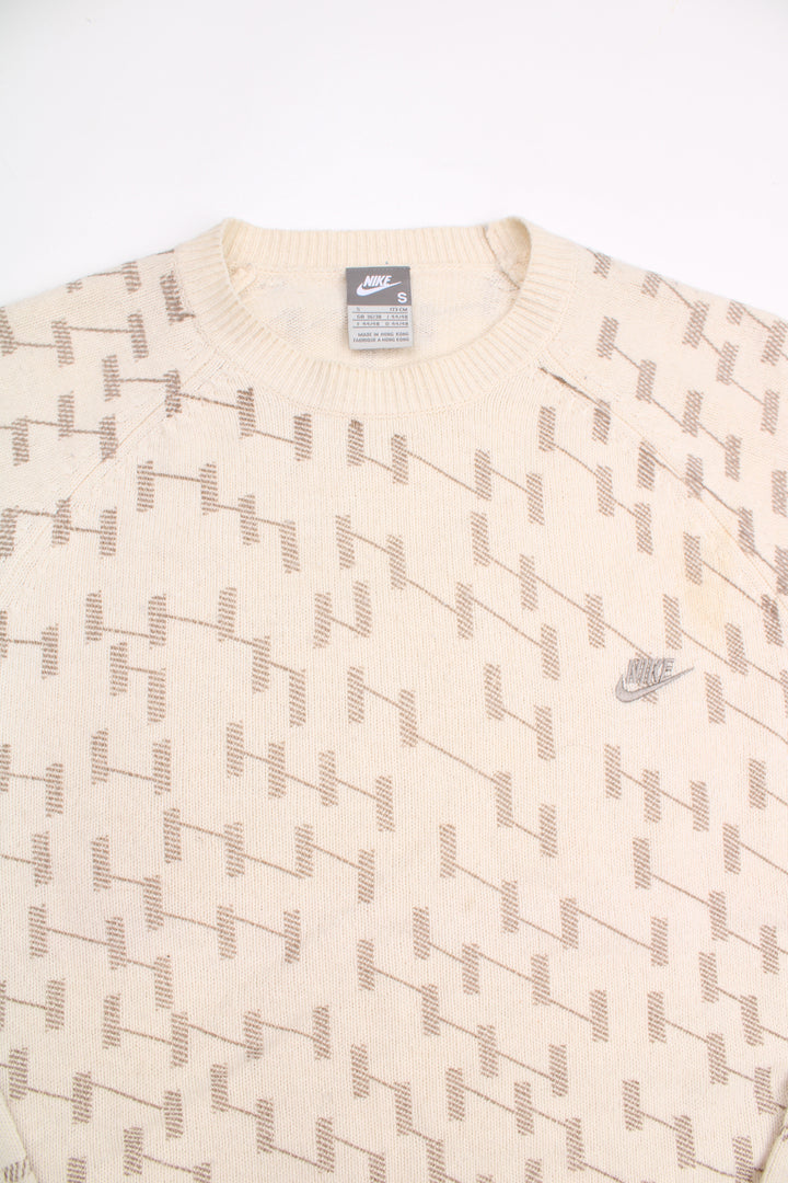 Y2K Nike cream with brown weave crew neck wool jumper, features embroidered swoosh logo on the chest and white elbow pads