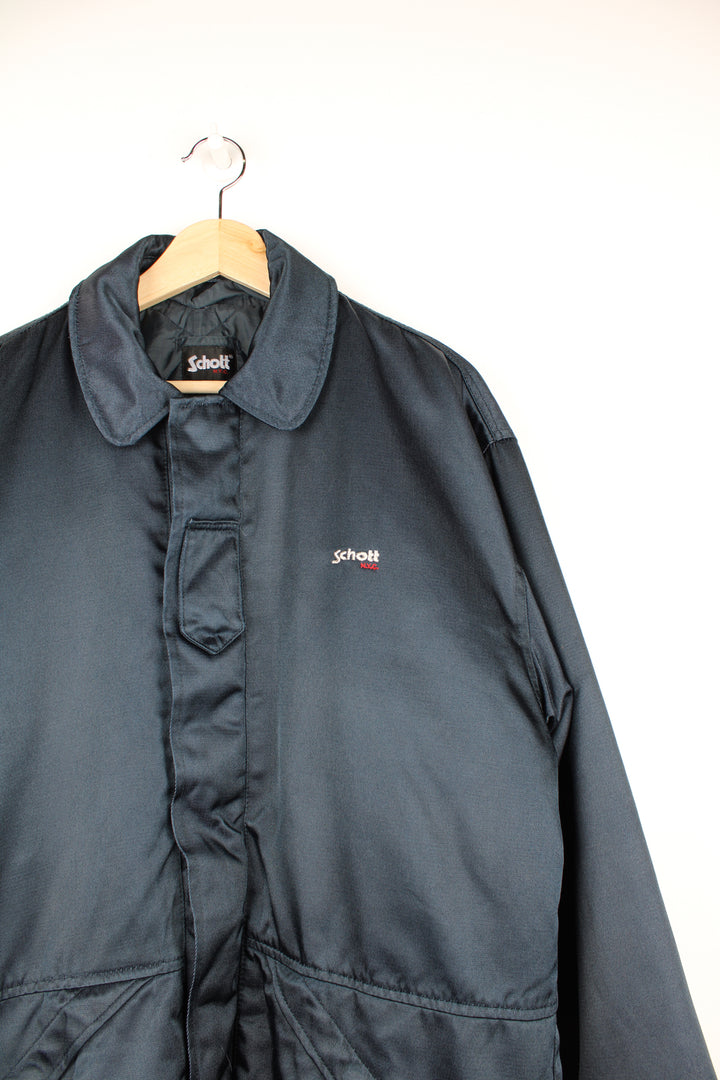 Vintage navy blue Schott zip through security jacket. features removable quilted liner, drawstring waist and pockets