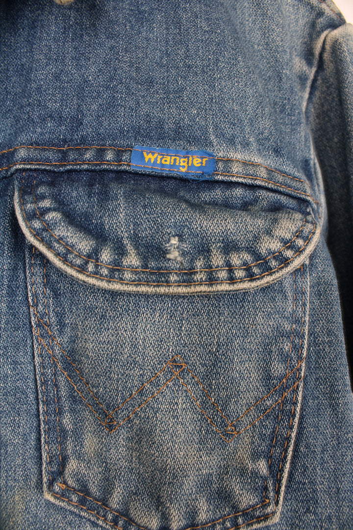 Vintage 1970's Wrangler blue denim button up trucker jacket with signature logo on the pocket