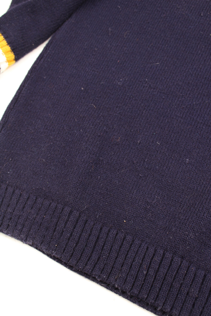 Vintage navy blue and yellow Fila knit jumper with high neck and embroidered logo on the chest 