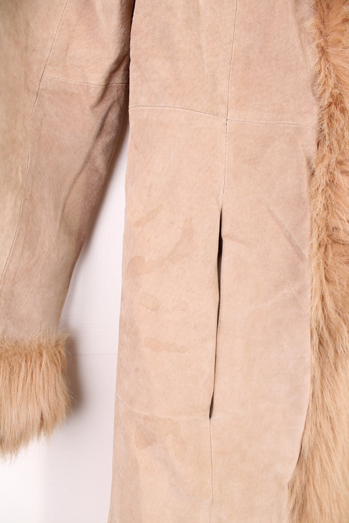 Y2K style tan suede floor length Afghan coat, features hook and eye closures and faux fur trim