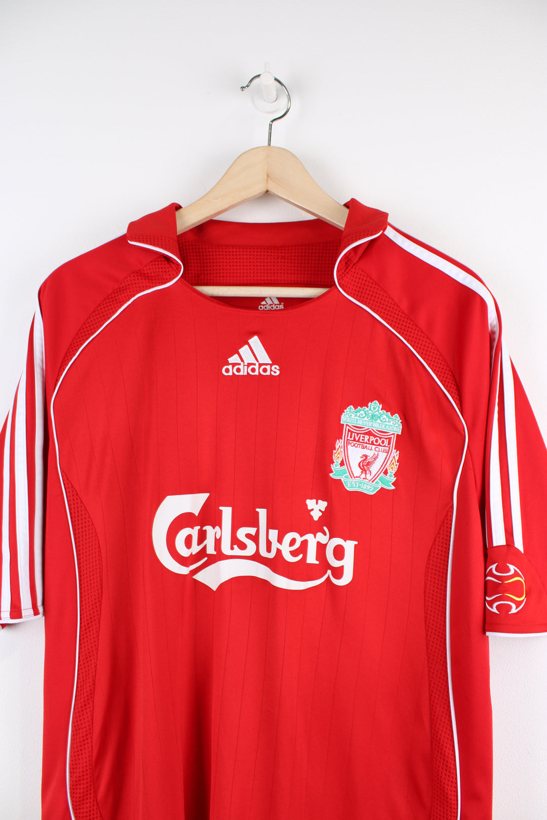 Vintage Liverpool 2006/08, Adidas Home Football Shirt, red and white team colourway, collar, Carragher number 23 printed on the back, and has logos embroidered on the front.