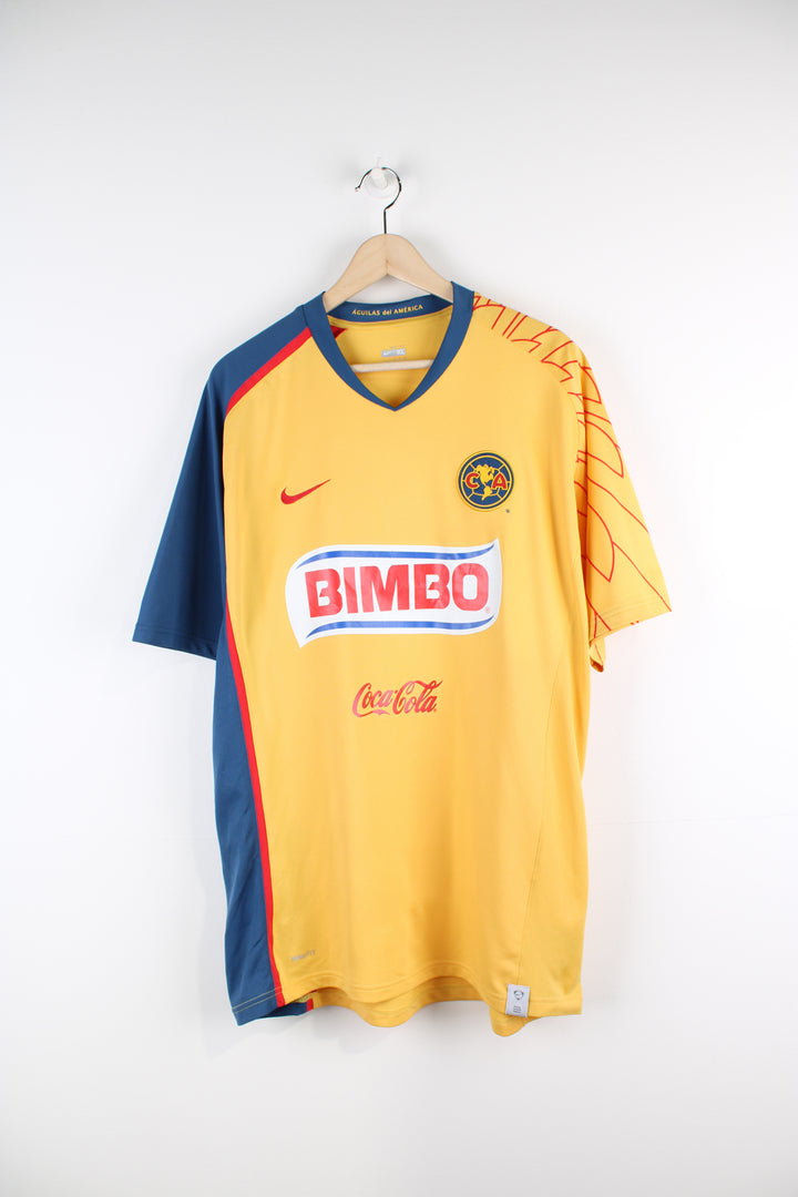 Vintage Club America 2007/08, Nike home football shirt, yellow, red and blue team colourway, v neck, and has logos printed on the front and back.