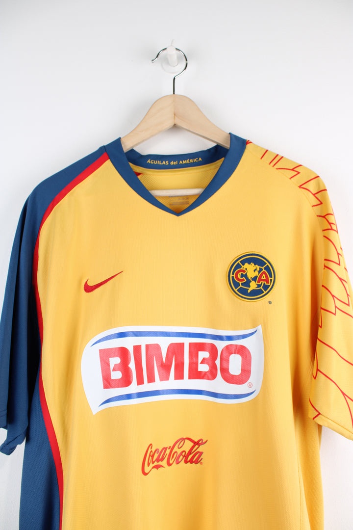 Vintage Club America 2007/08, Nike home football shirt, yellow, red and blue team colourway, v neck, and has logos printed on the front and back.