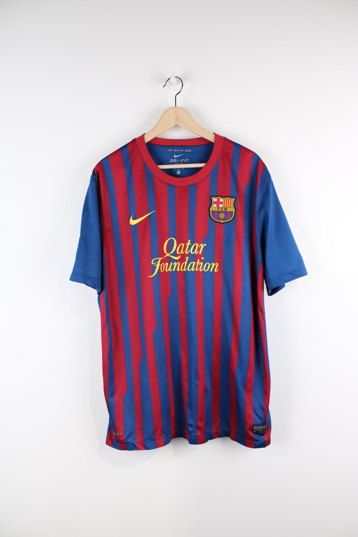 Vintage Barcelona 2011/12, Nike Home Football Shirt, blue, red and yellow colourway, and has logos printed throughout.