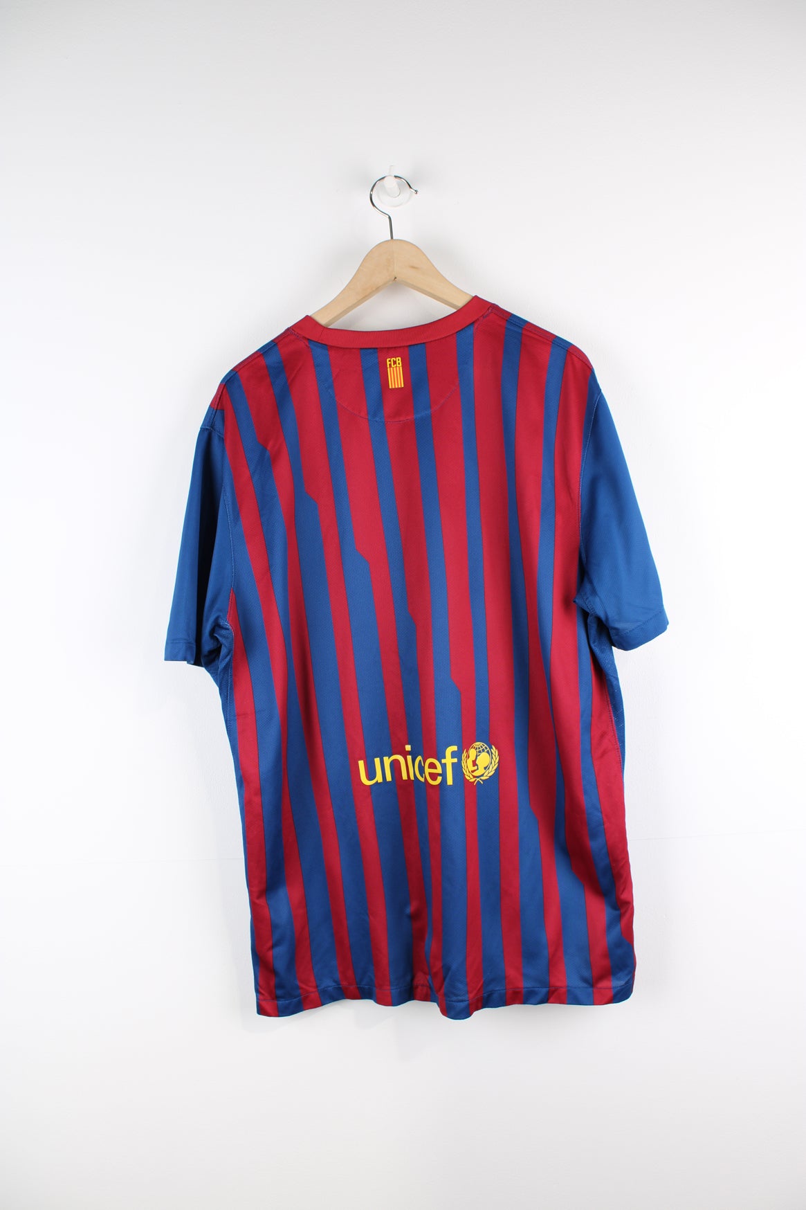 Vintage Barcelona 2011/12, Nike Home Football Shirt, blue, red and yellow colourway, and has logos printed throughout.