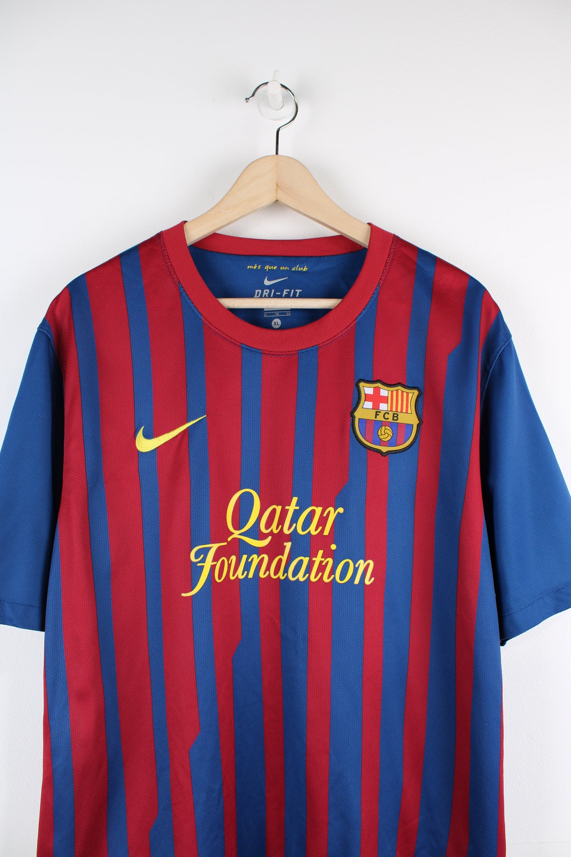 Vintage Barcelona 2011/12, Nike Home Football Shirt, blue, red and yellow colourway, and has logos printed throughout.