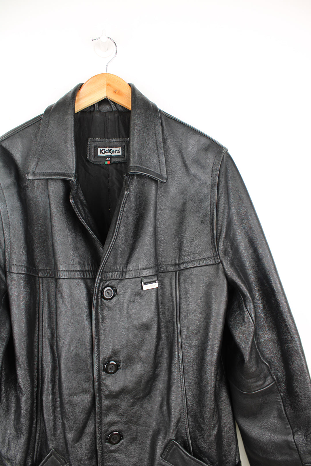 Vintage 90's Kickers black leather 3/4 length coat, features pockets and metal branded tab on the chest