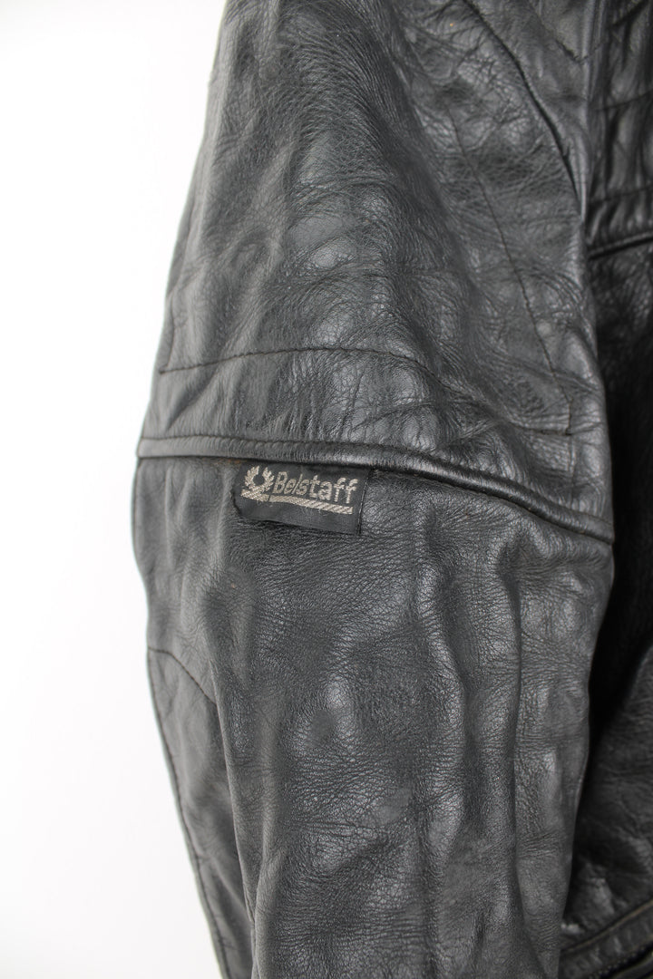 Vintage Belstaff Cafe Racer style black leather biker jacket, with multiple pockets and adjustable waistband buckles 