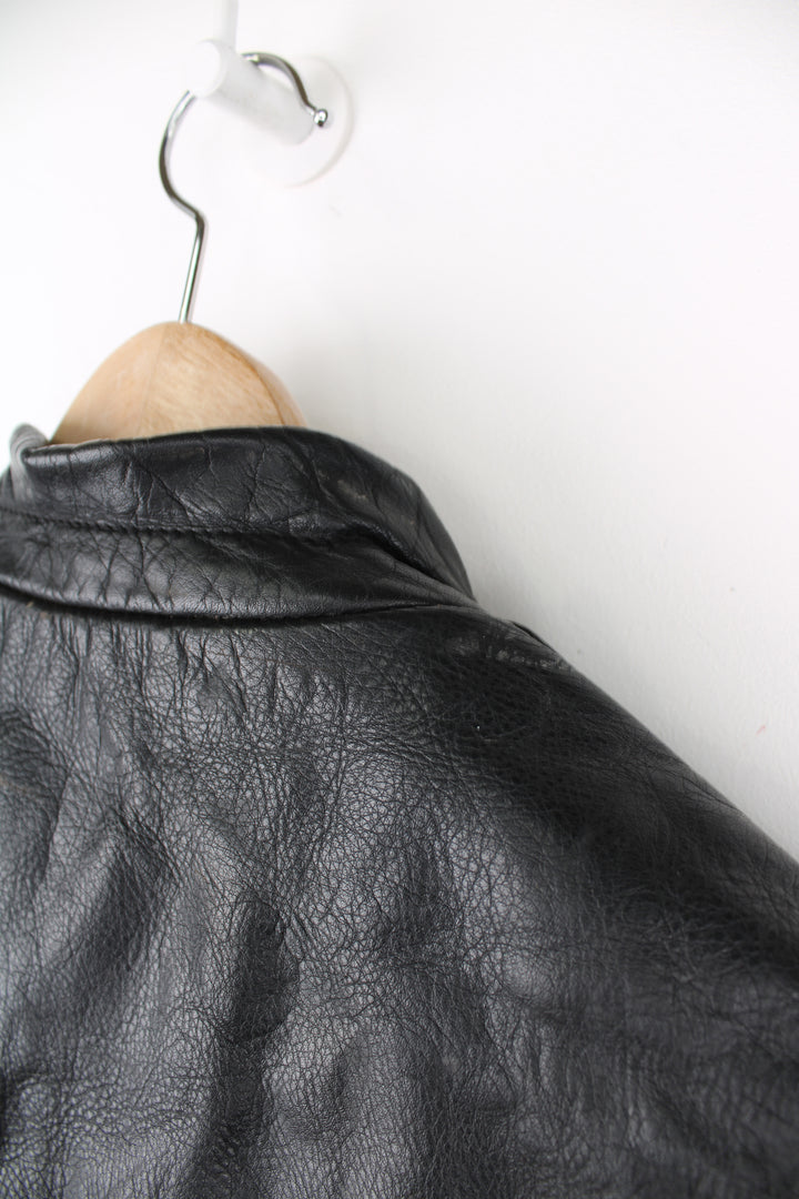 Vintage Belstaff Cafe Racer style black leather biker jacket, with multiple pockets and adjustable waistband buckles 