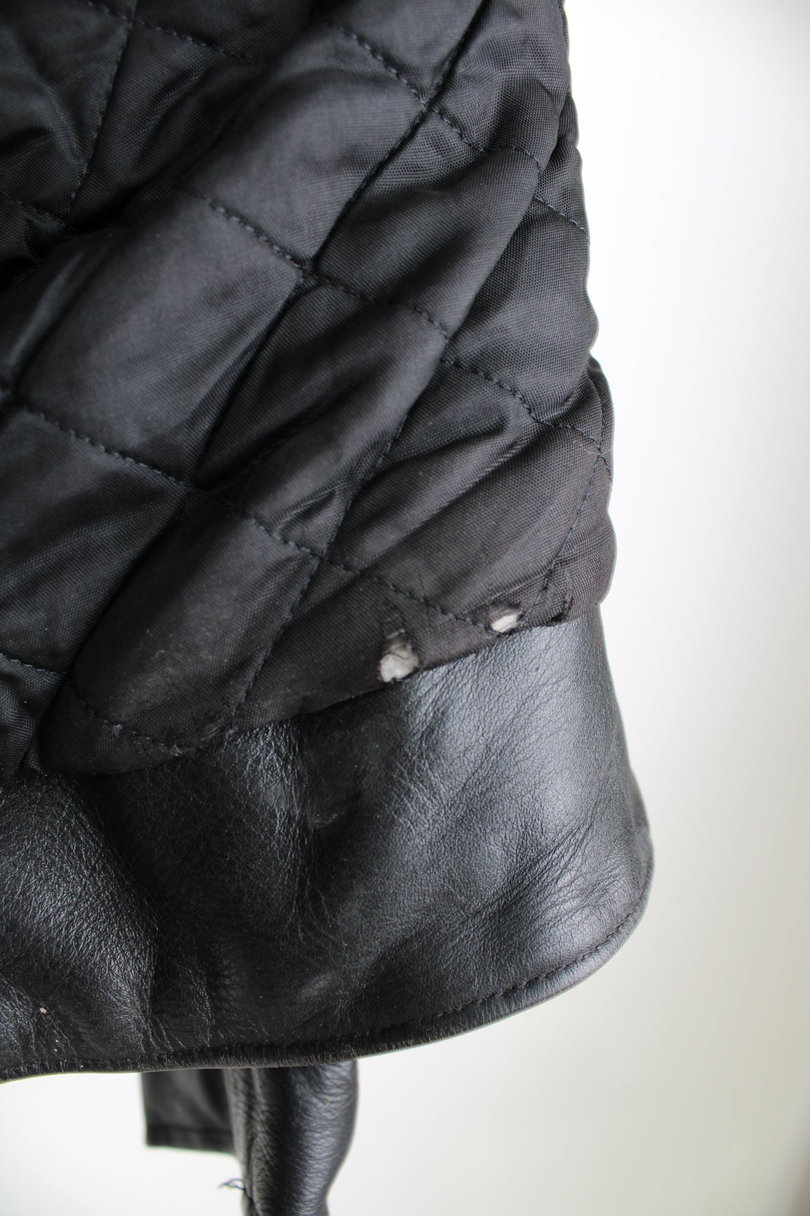 Vintage Belstaff Cafe Racer style black leather biker jacket, with multiple pockets and adjustable waistband buckles 